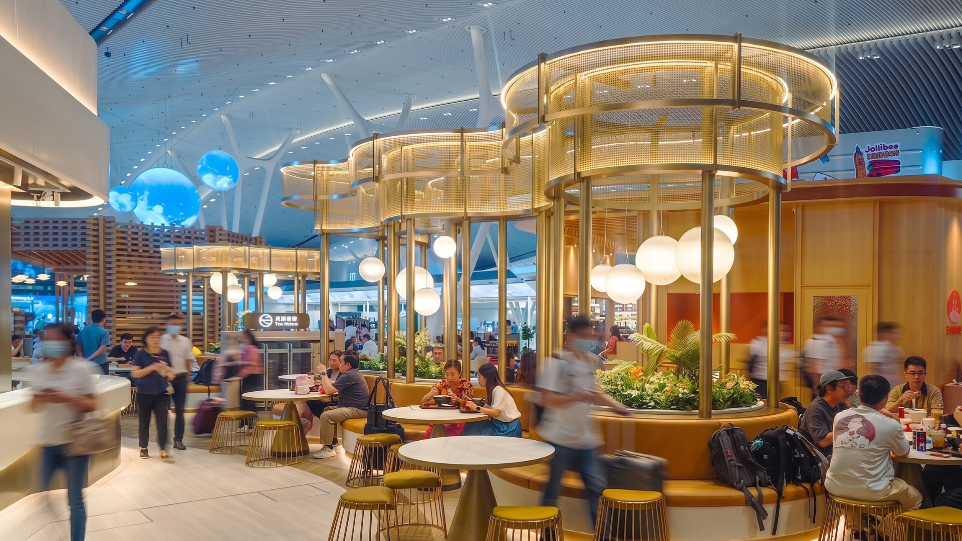 Hong Kong International Airport – Terminal 2 — Hong Kong, China: Hong Kong International Airport Terminal 2 — dining area with warm decorative lighting, Lichtvision lighting design