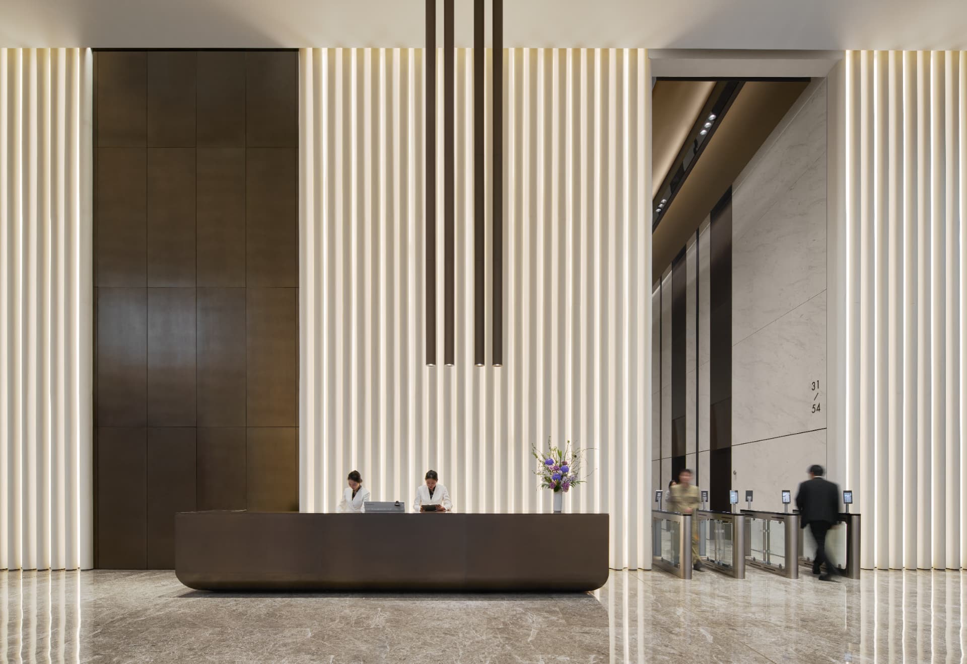 No.1 Shennan Road — Shenzhen, China: No.1 Shennan Road, Shenzhen — main reception desk in front of the illuminated fluted wall