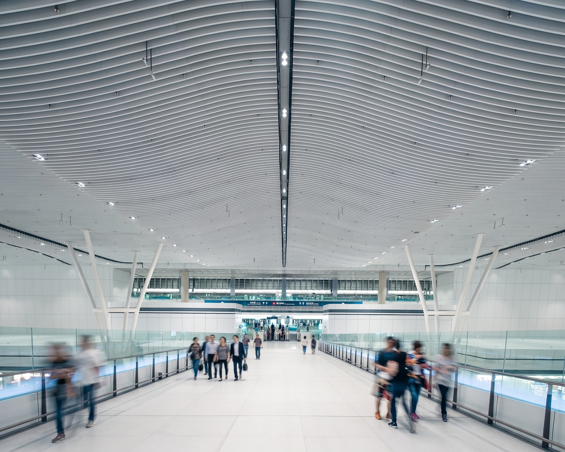 Hong Kong International Airport – Terminal 2 — Hong Kong, China: Hong Kong International Airport Terminal 2 — connecting bridge beneath the ribbed ceiling, Lichtvision lighting design