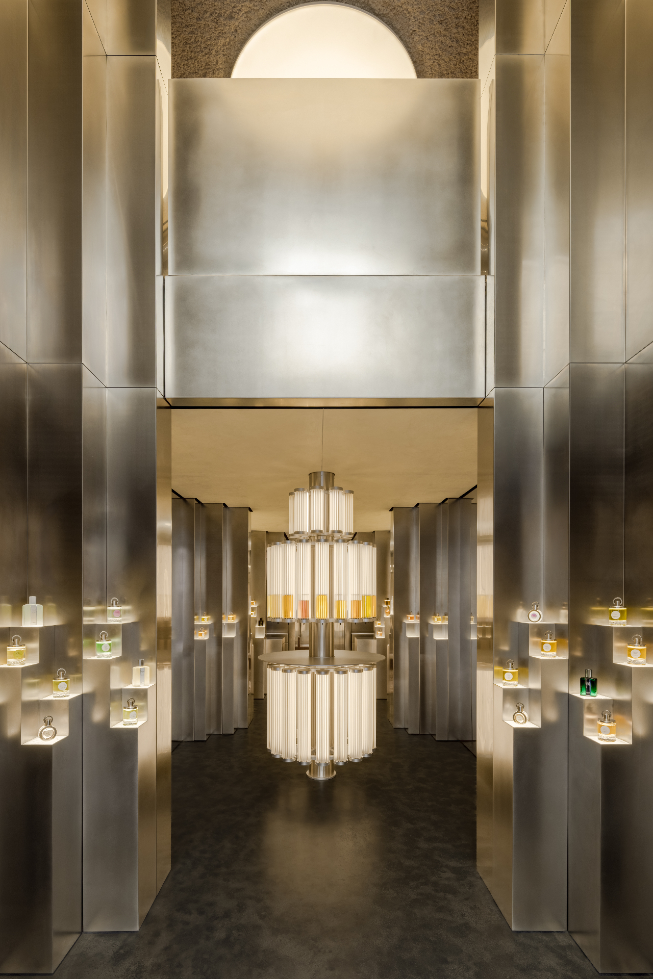 Parfums Caron, Rue Saint Honoré — Paris, France: Central illuminated perfume fountain within the metallic interior of the Caron boutique