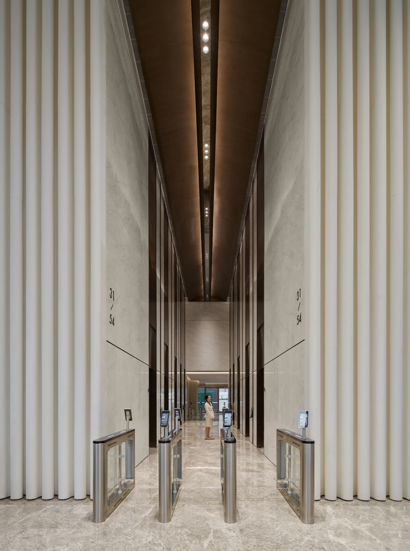No.1 Shennan Road — Shenzhen, China: No.1 Shennan Road, Shenzhen — entrance gates in the double-height lift lobby